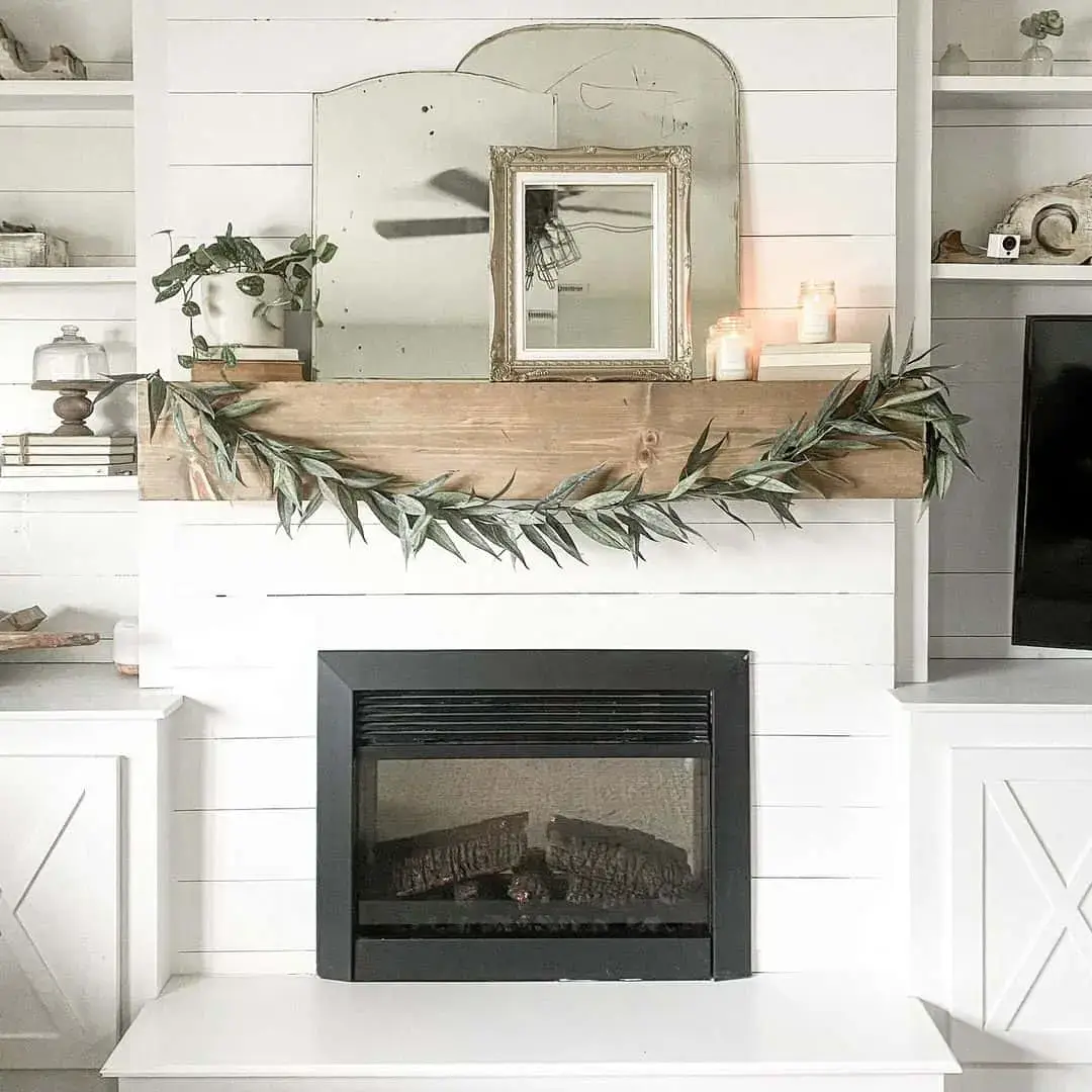 Layered Mirrors Create a Dramatic Focal Point Above the Mantel