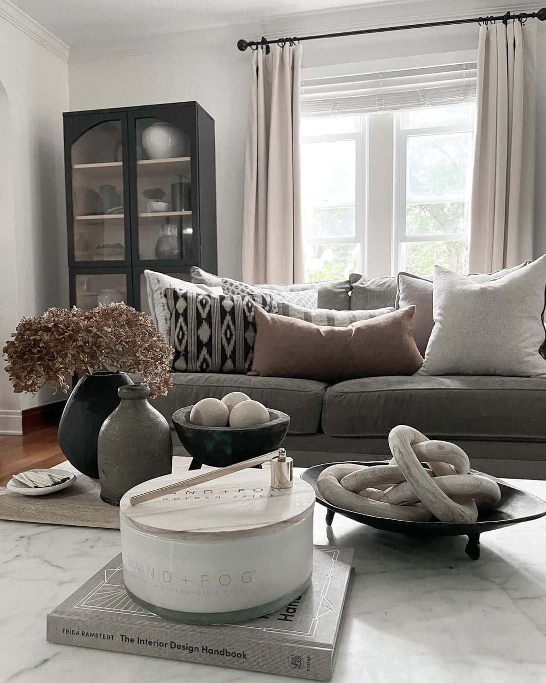 Layer books and decor for a grounded centerpiece
