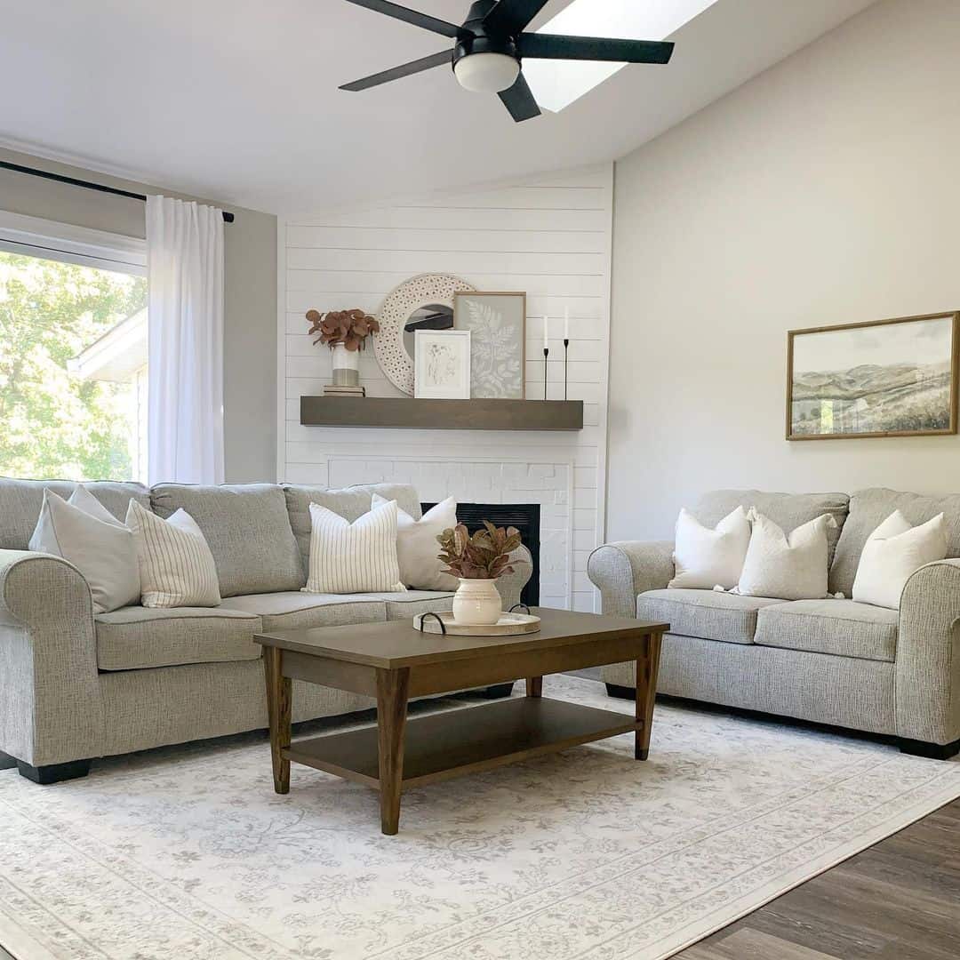 Two-tiered dark wood coffee table holds decorative accents