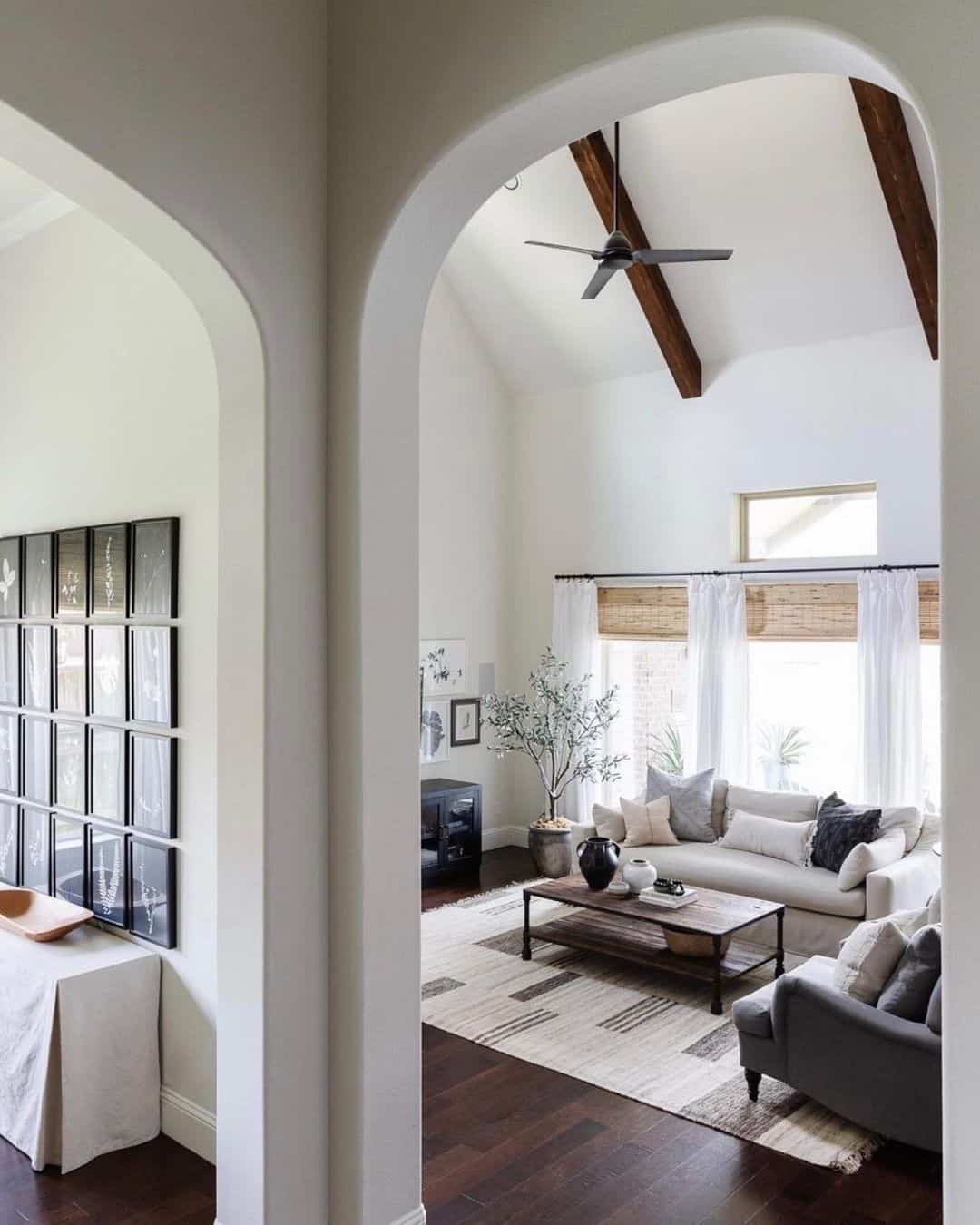 Arched entryway frames a grid of botanical prints