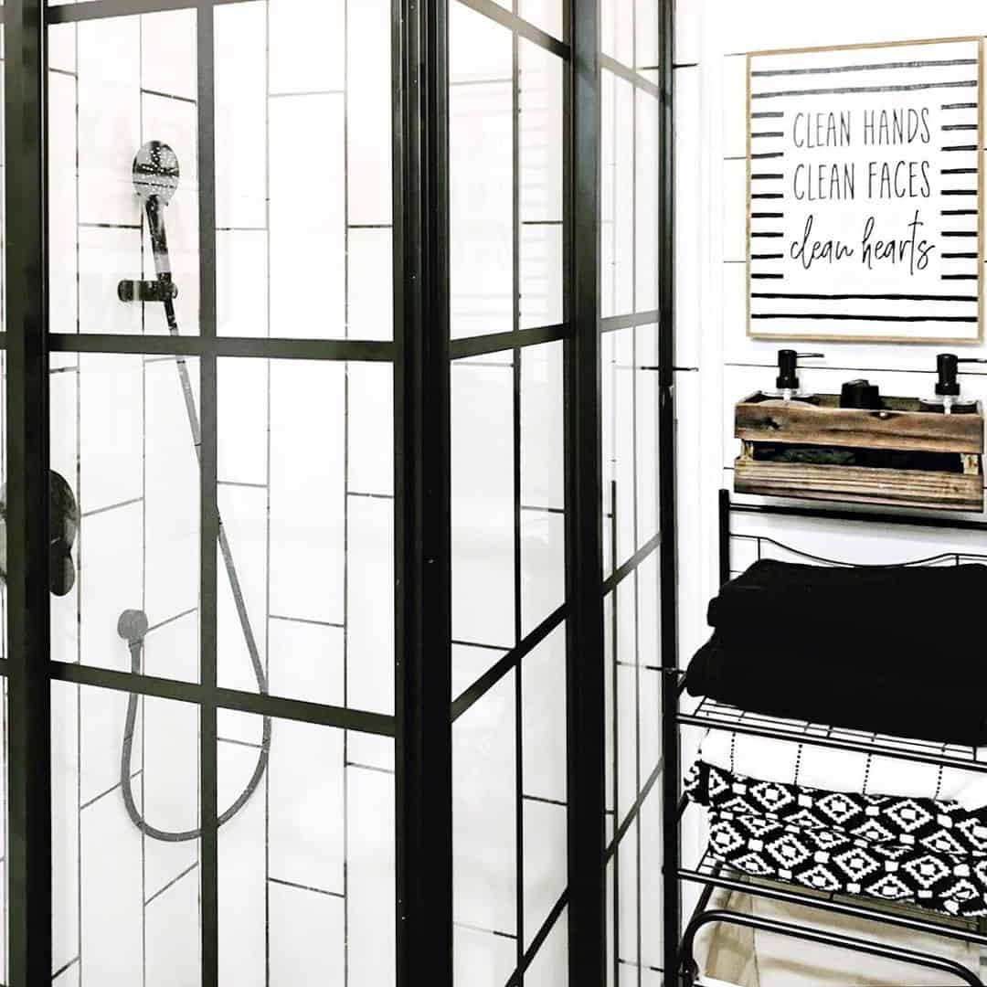Vertical White Tile Pairs with a Black Grid Shower Door