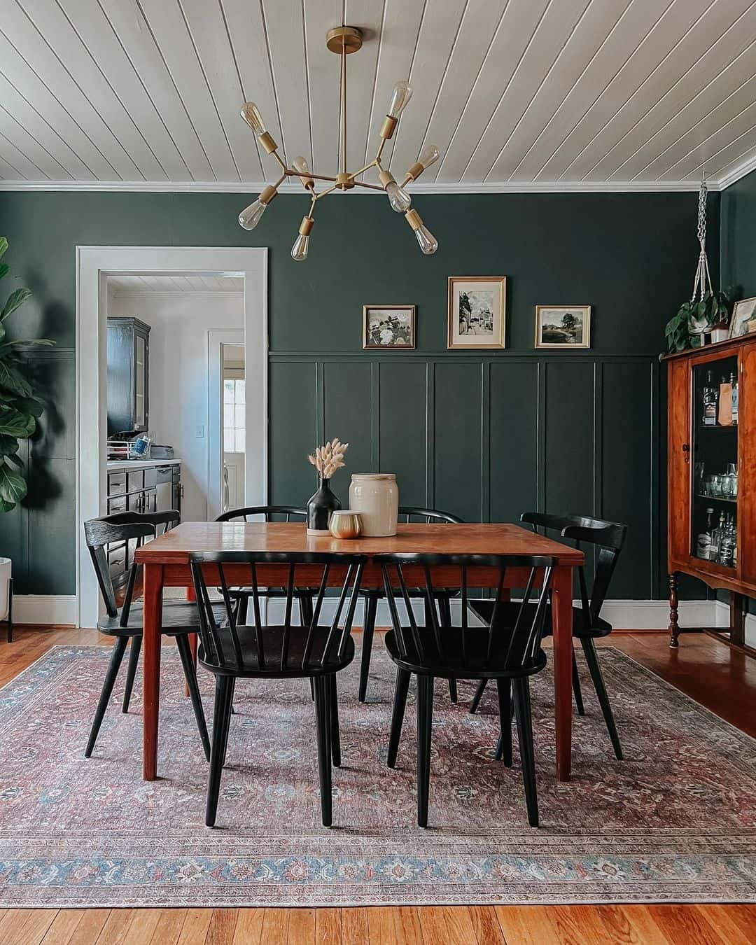 Deep Green Vertical Panels Ground a Dining Space