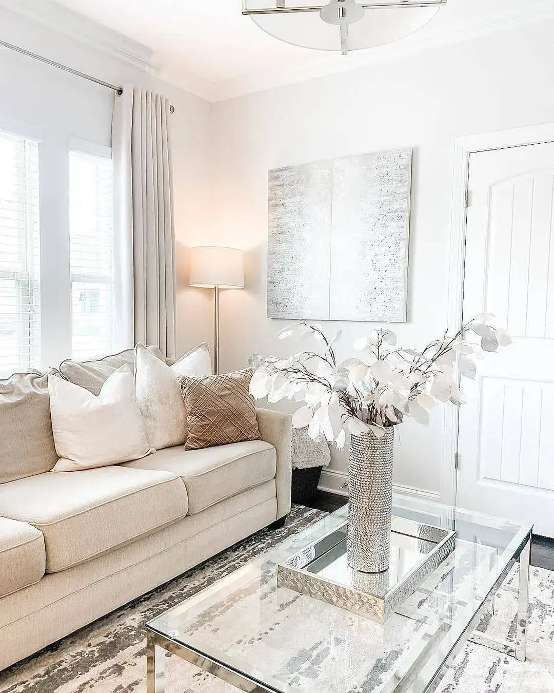 Mirrored Tray Holds Textured Vase for a Glamorous Coffee Table