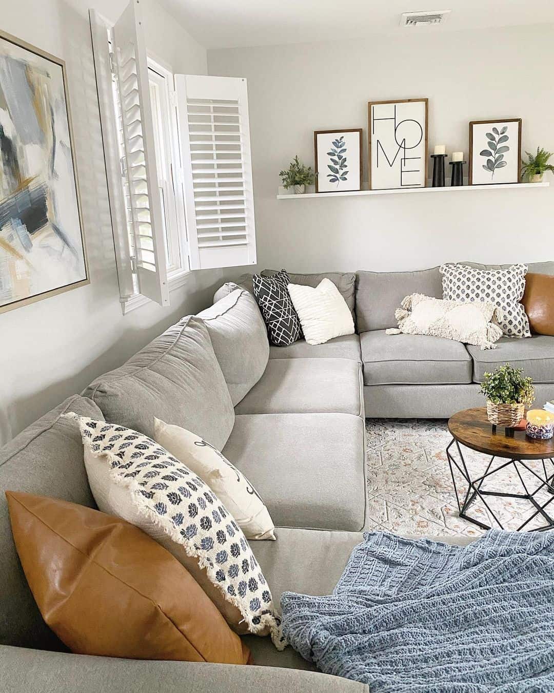 Layer Pillows for Pattern and Texture on a Neutral Sofa