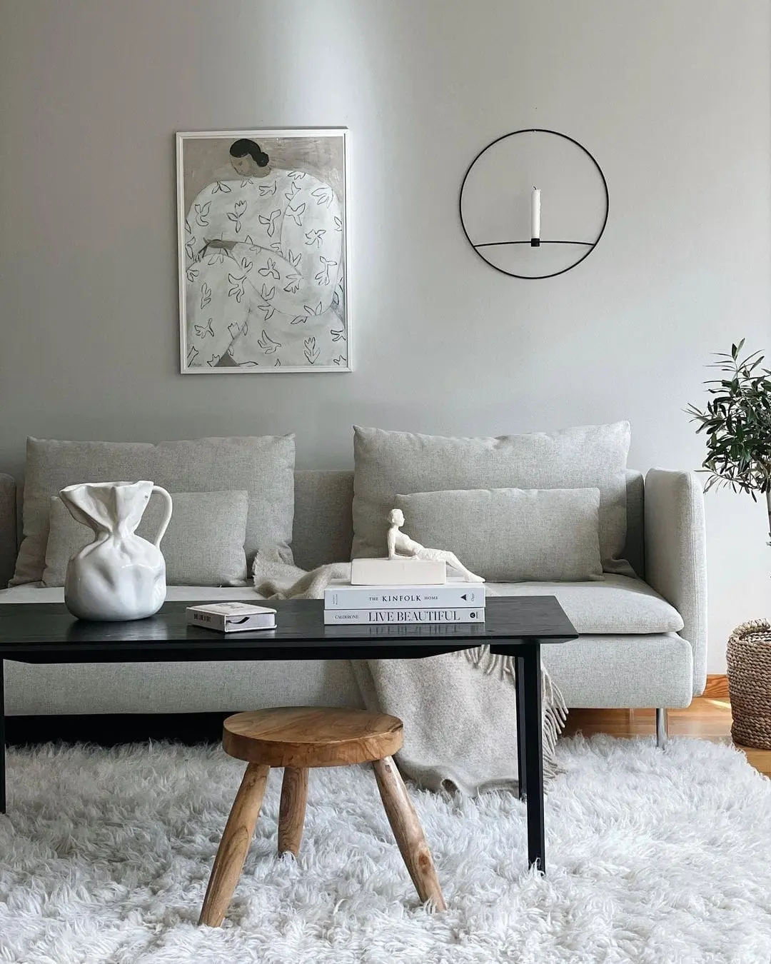 Soften a Modern Sofa with Layered Neutral Throws