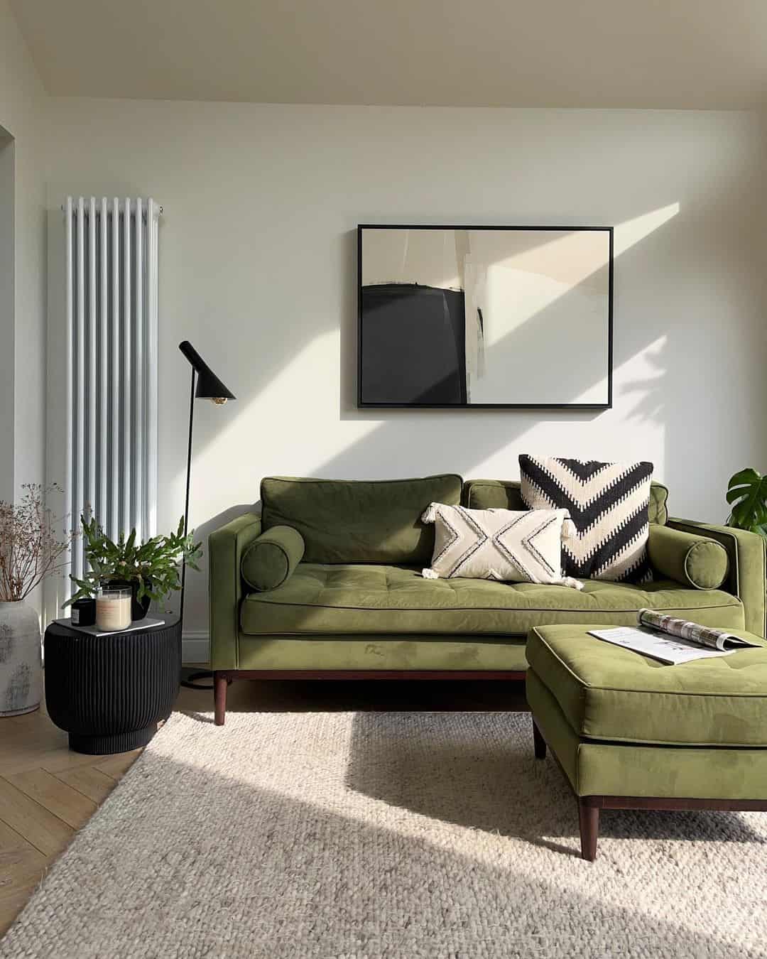 Abstract Artwork Anchors a Plush Olive Green Sofa