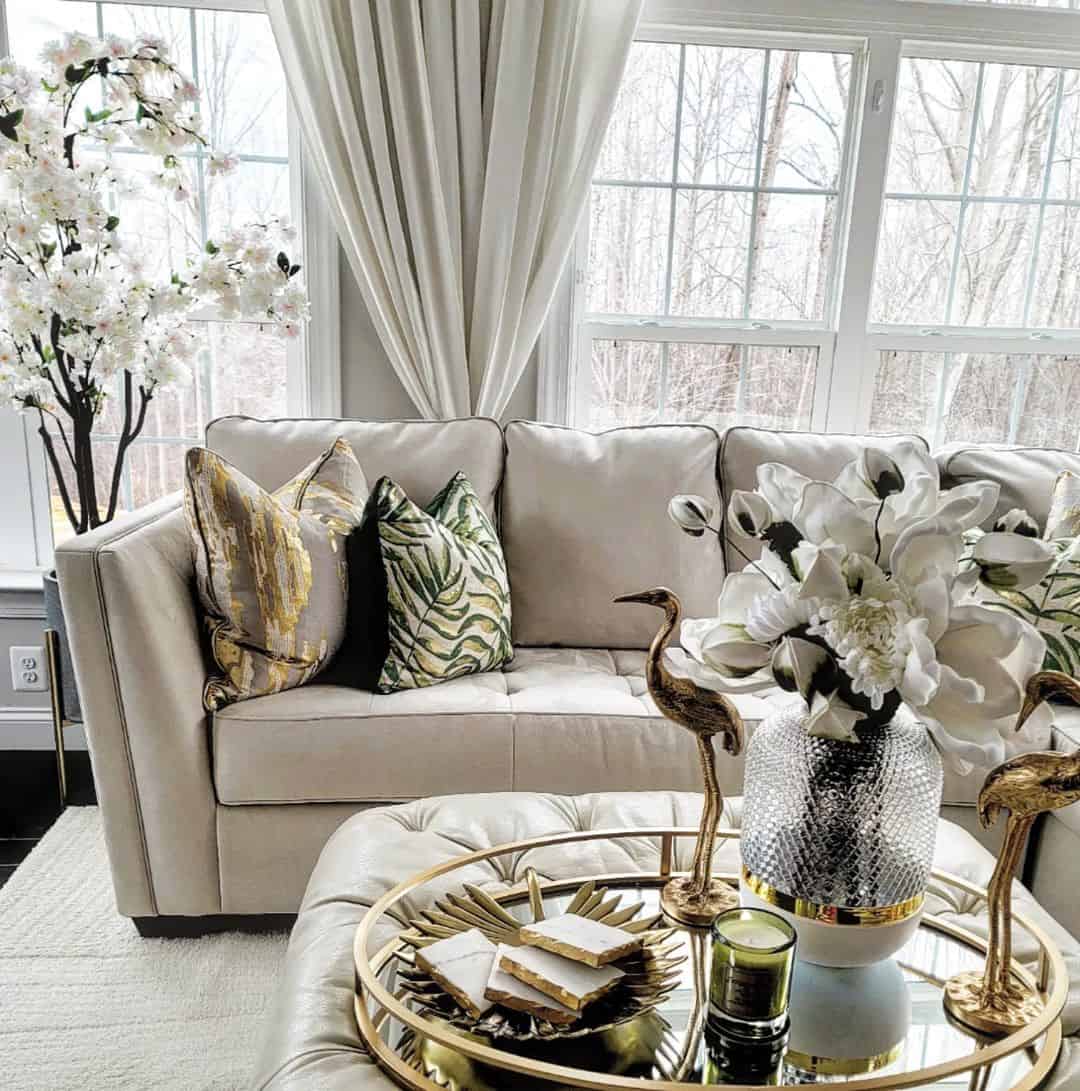 Gold Crane Statues Add Whimsical Flair to Ottoman Vignette