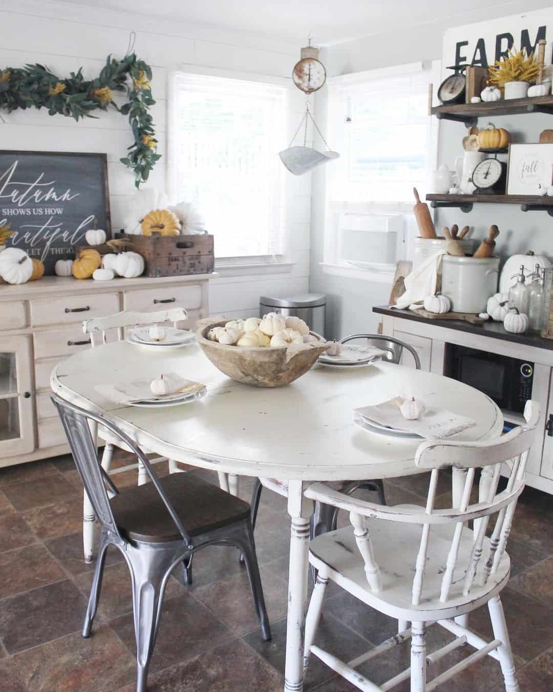 Distressed White Table with Industrial and Wooden Chairs