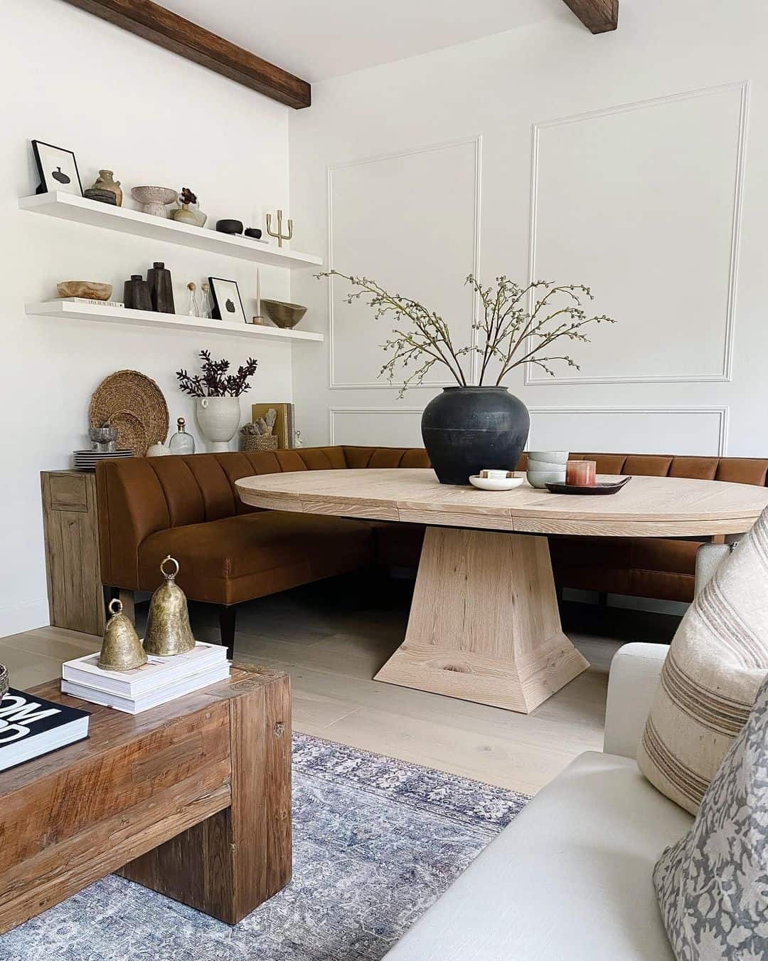 Light Wood Table with Caramel Upholstered Banquette