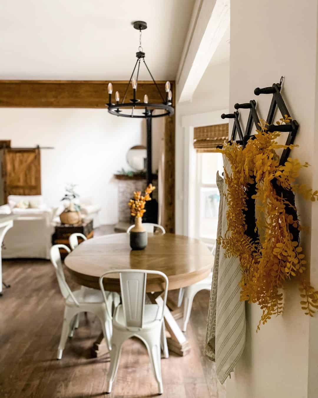 Industrial-Inspired Pedestal Table with White Metal Chairs