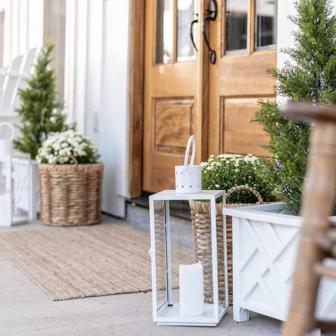 White Lanterns and Woven Basket Planter Frame Porch Entry