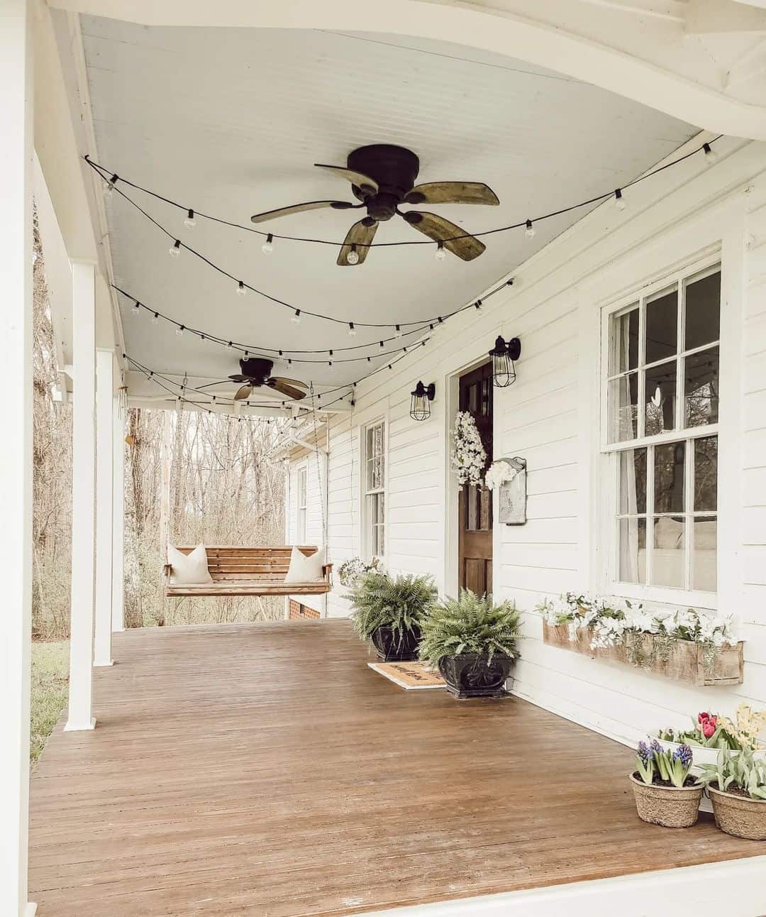 String Lights Drape Over Porch Fans for Cozy Ambiance