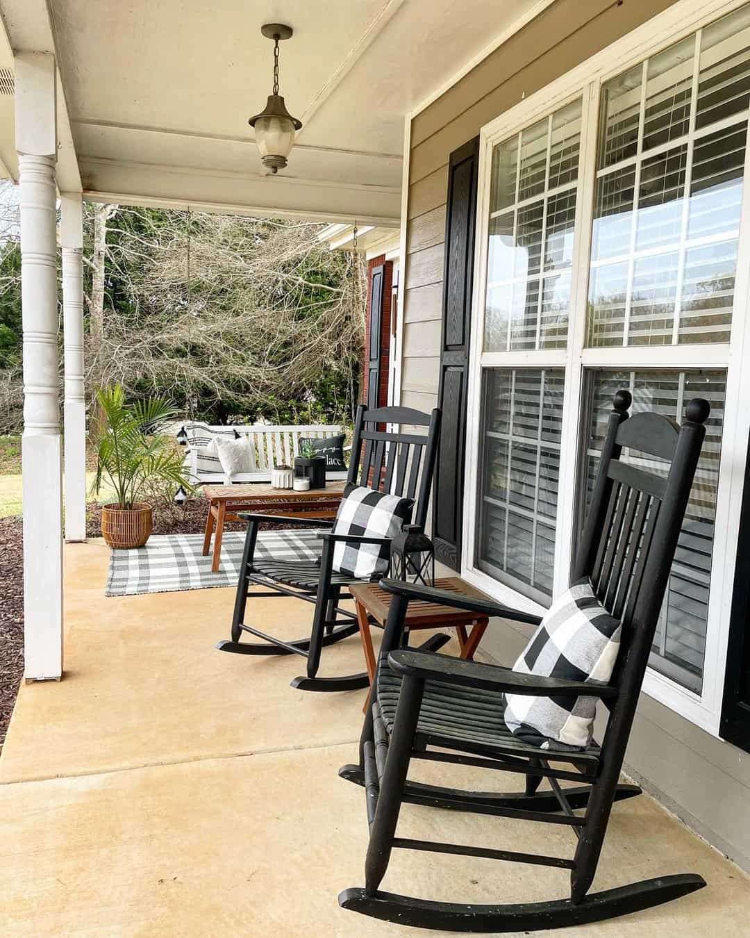 Black Rocking Chairs with Buffalo Check Pillows for Cozy Seating