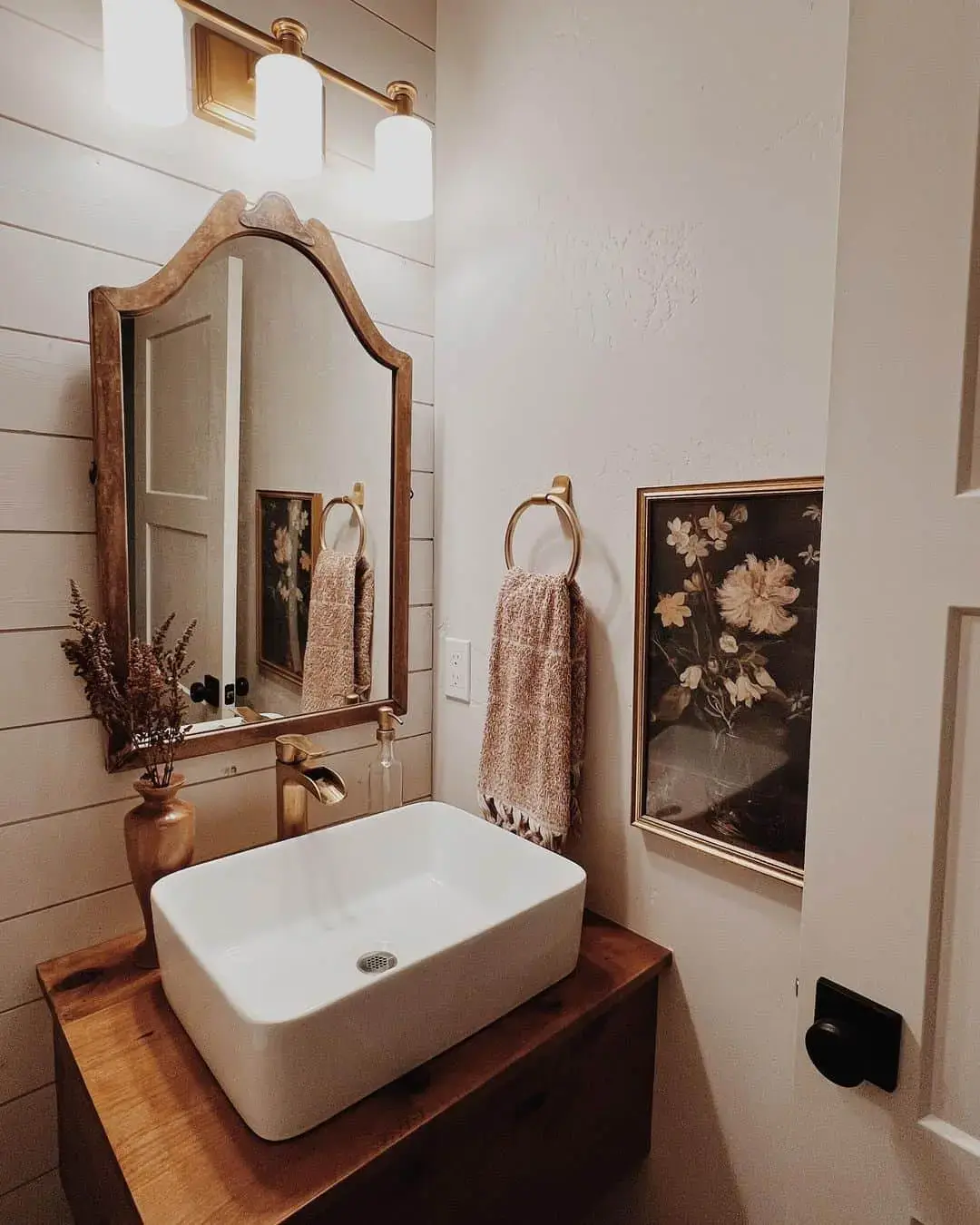 Framed Floral Art Adds Softness Above a Wood Vanity