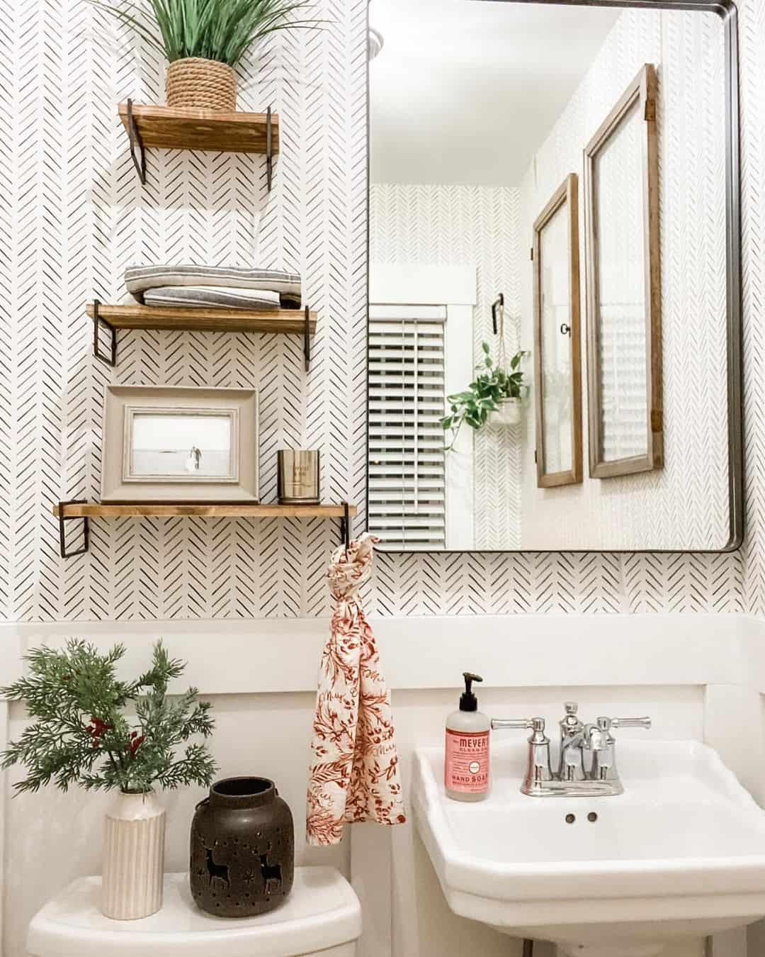 Floating Wood Shelves Hold Rolled Towels and Framed Art