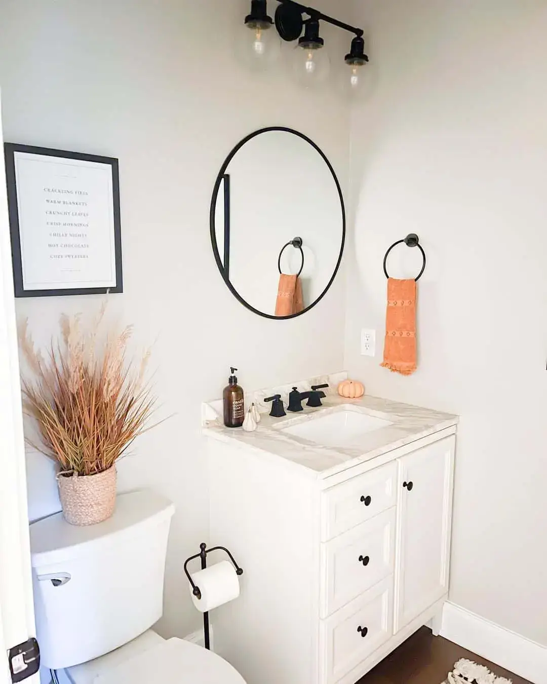 Round Mirror with Towel Ring Adds a Chic Focal Point