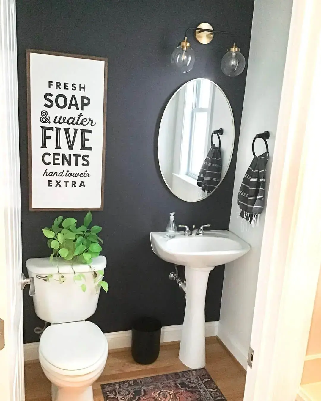 Tall Vertical Sign Adds Whimsical Charm Above the Toilet