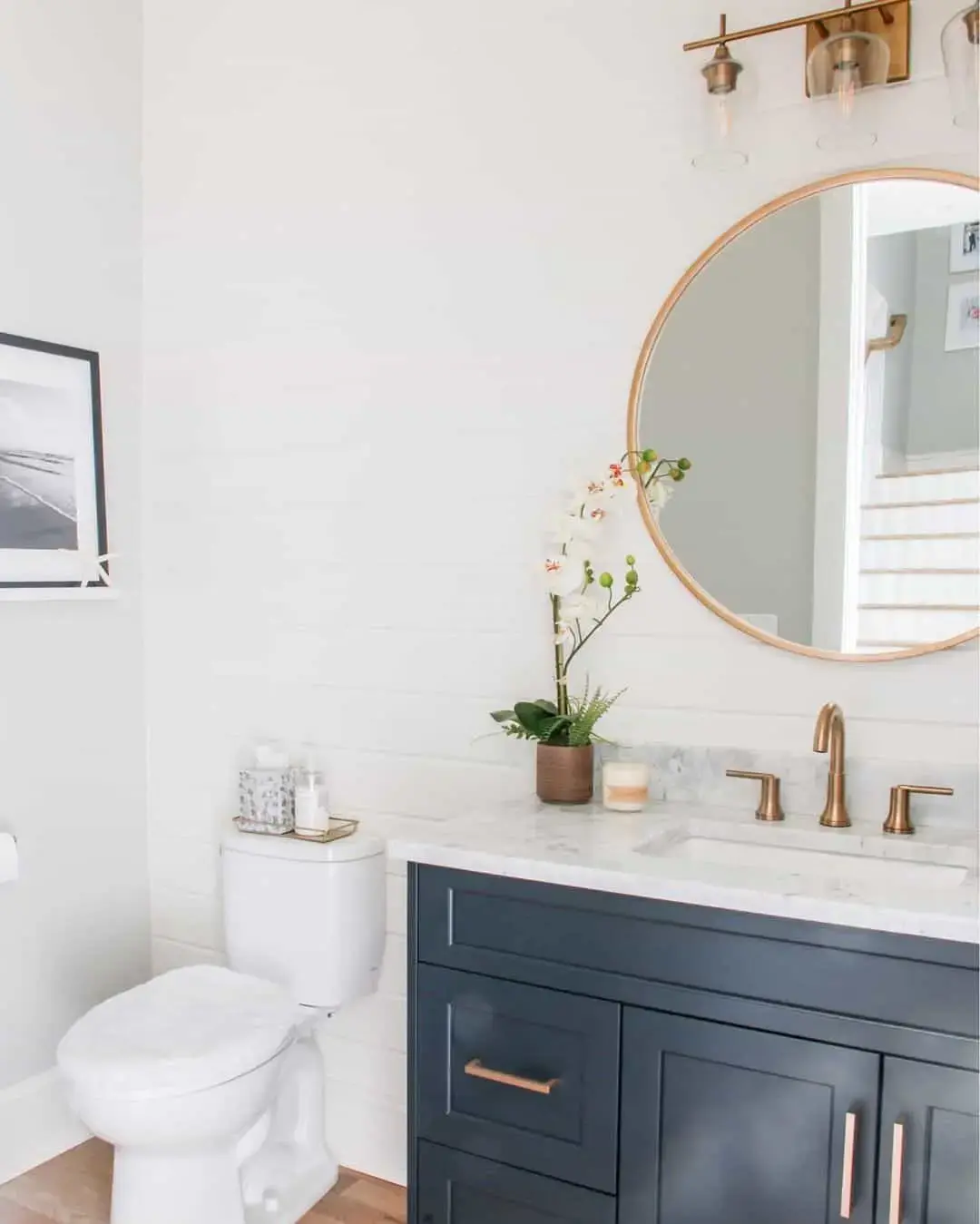 Contrast Dark Vanity with Brass Faucets and Hardware