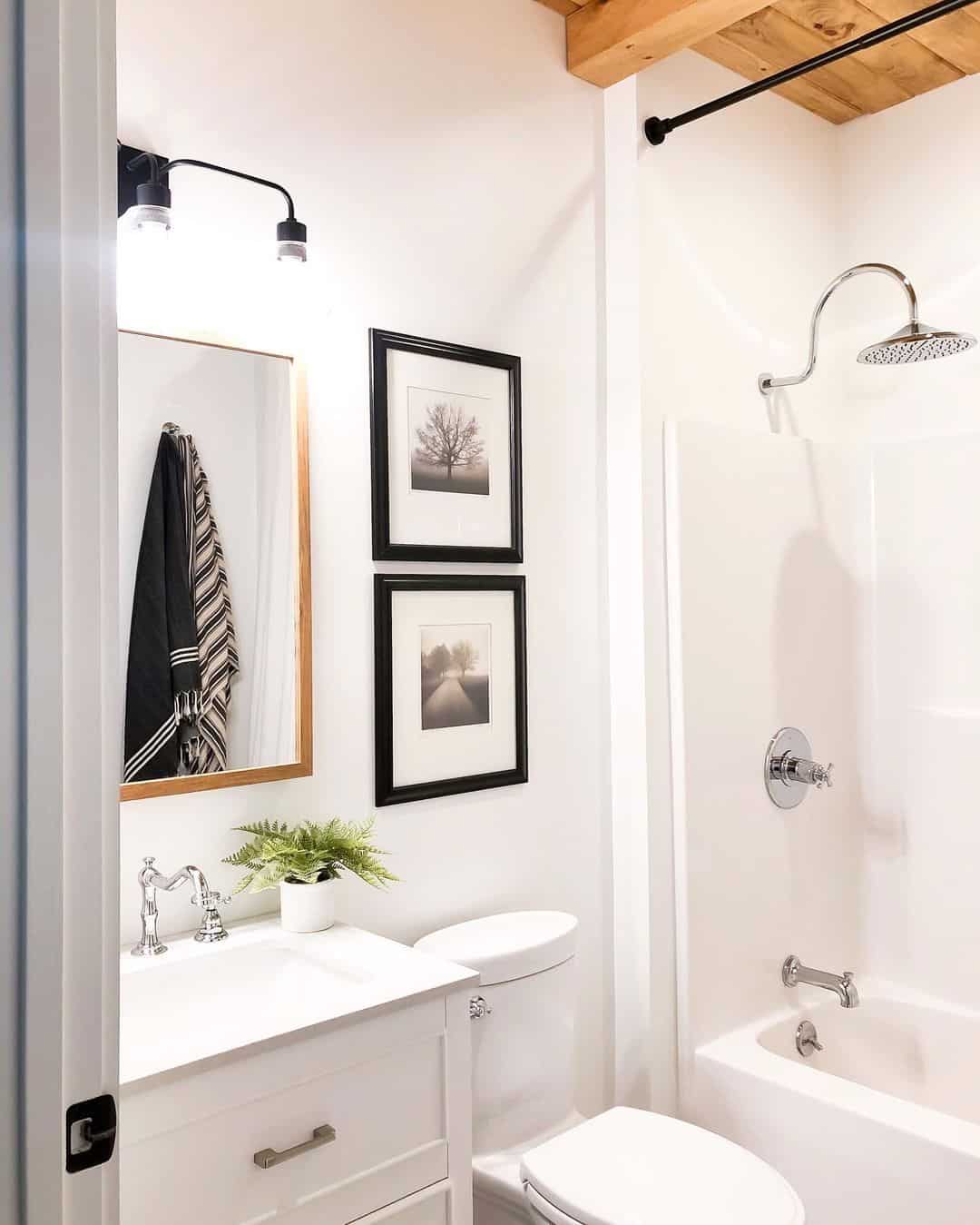 Stacked Black Frames Add Vertical Interest Above Vanity