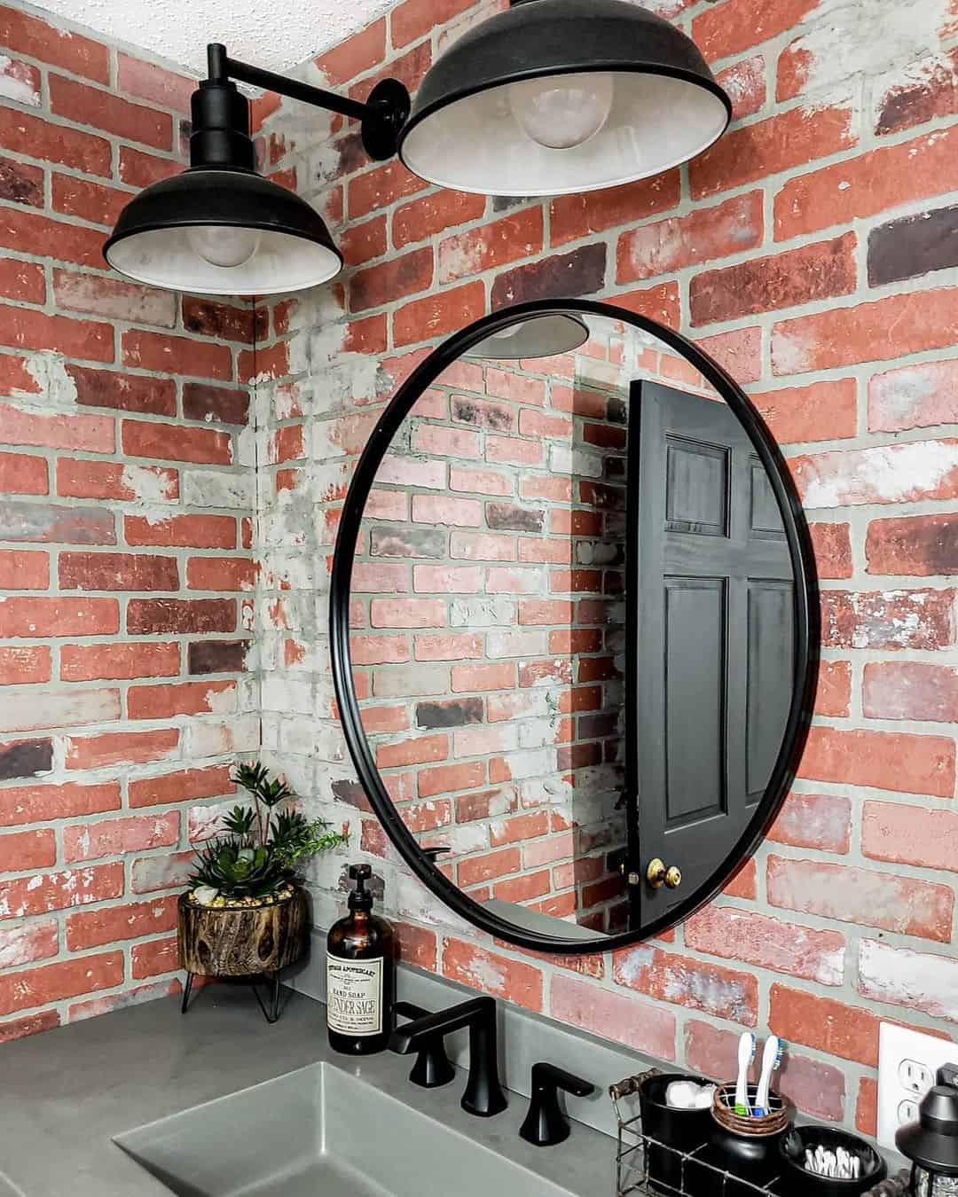 Black Barn-Style Lights Cast Industrial Charm Above Oval Mirror