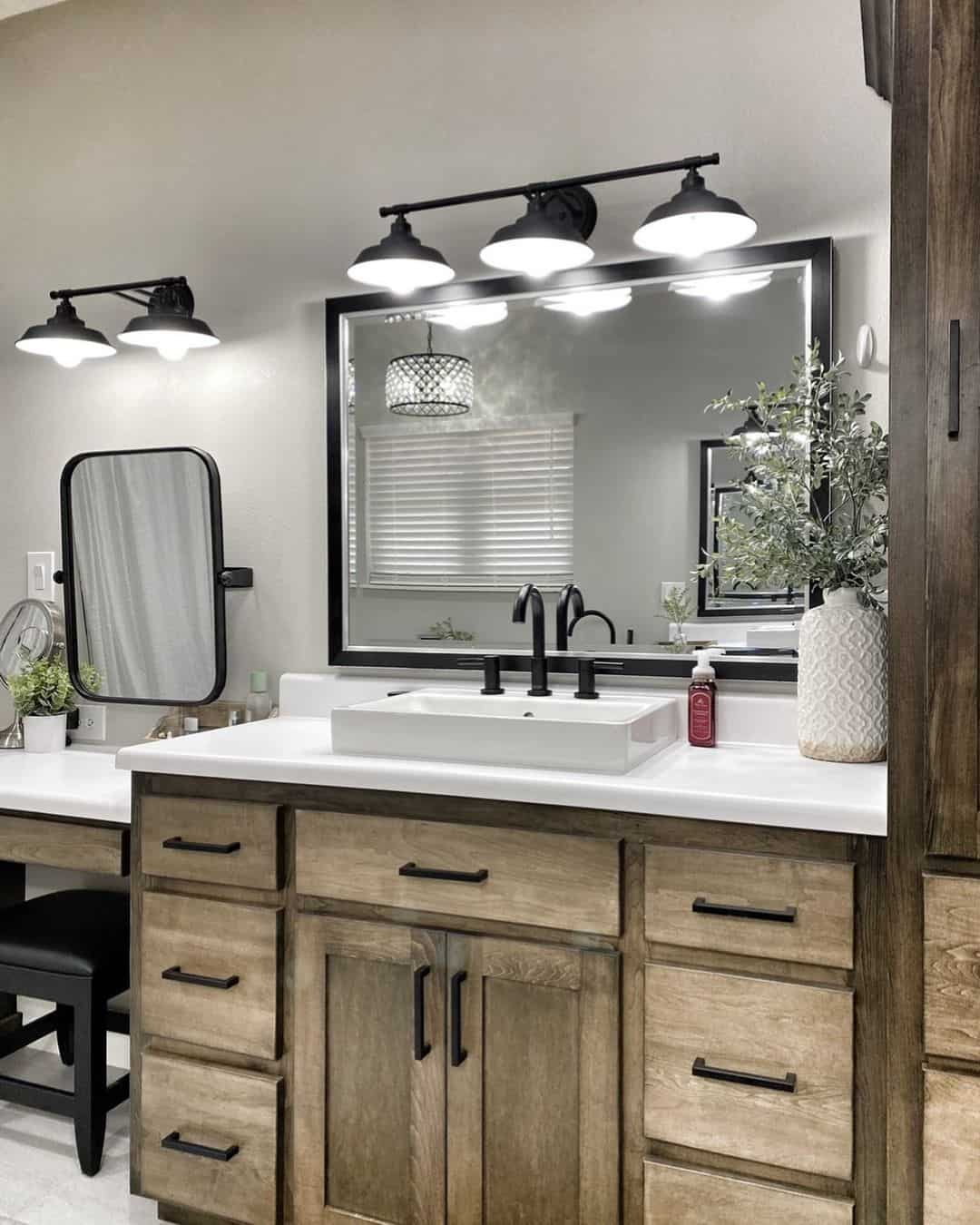 Three Matte Black Barn Lights Above the Vanity