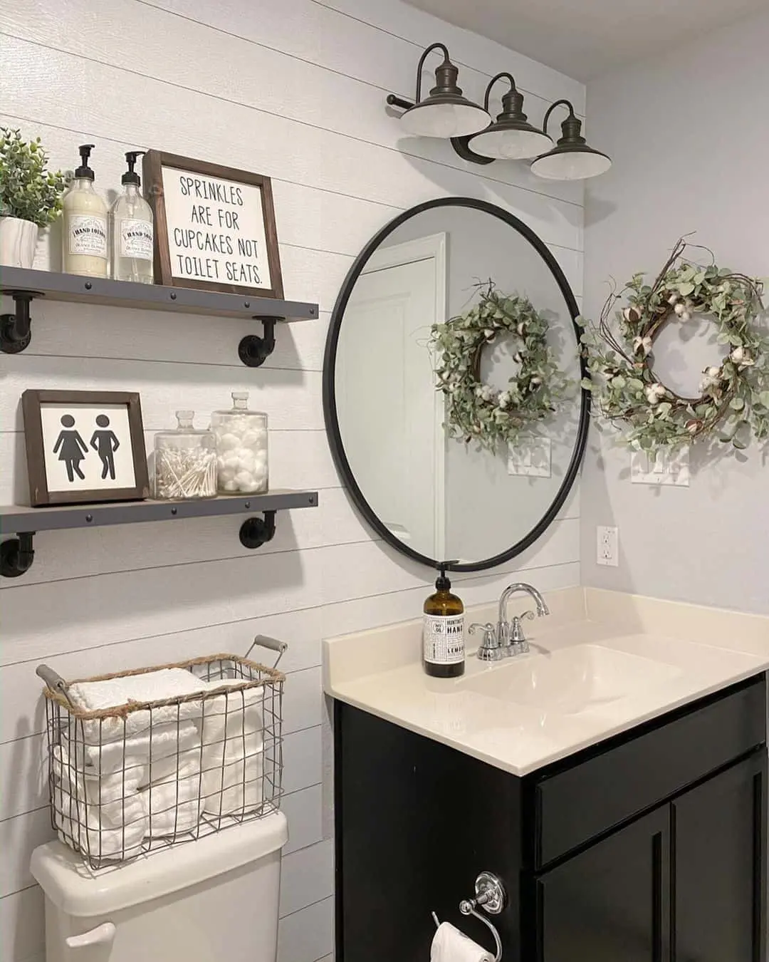 Triple Industrial Sconces Light Up a Round Mirror