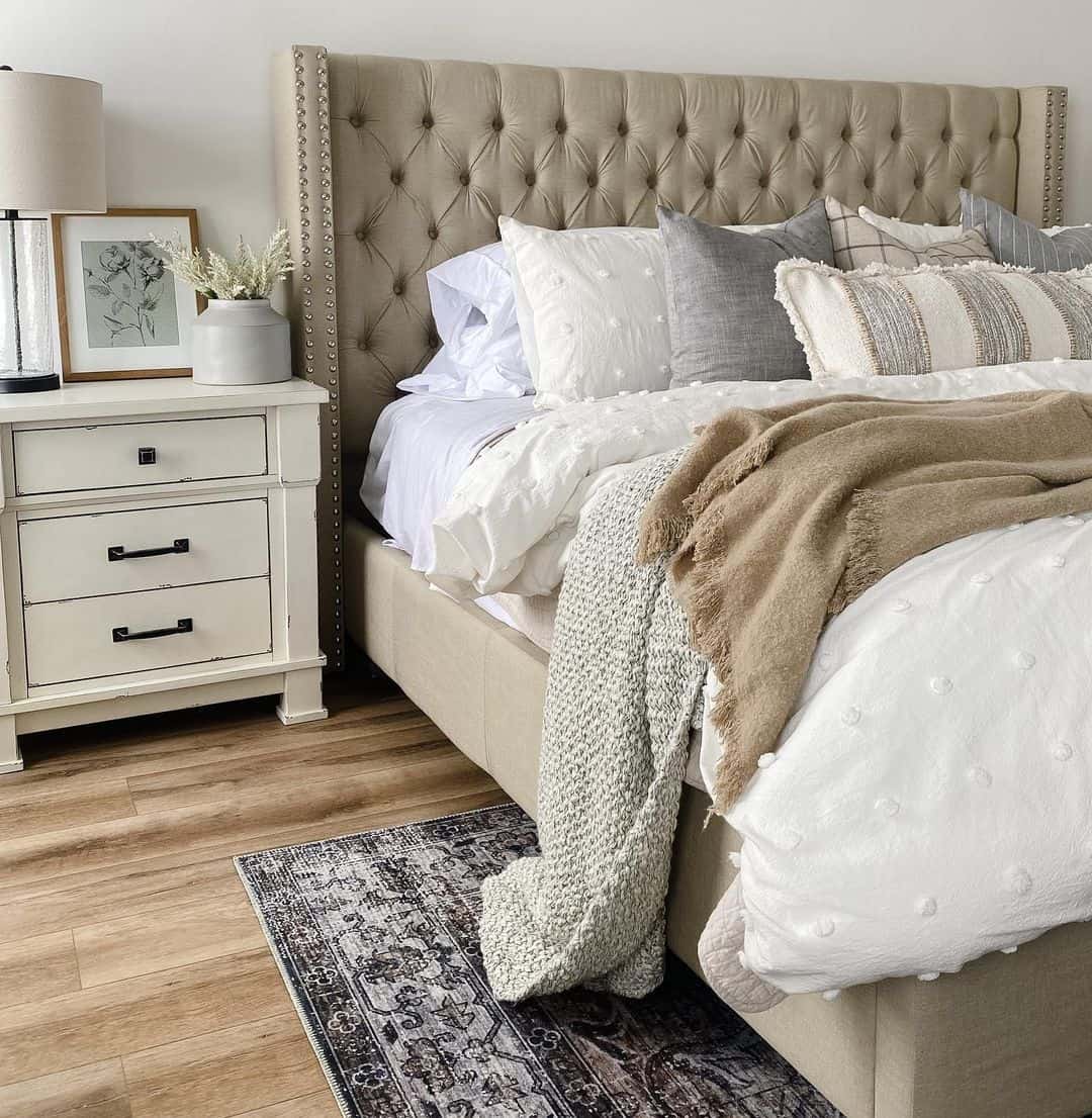 Tufted Wingback Headboard in Neutral Upholstery Creates a Soft Focal Point