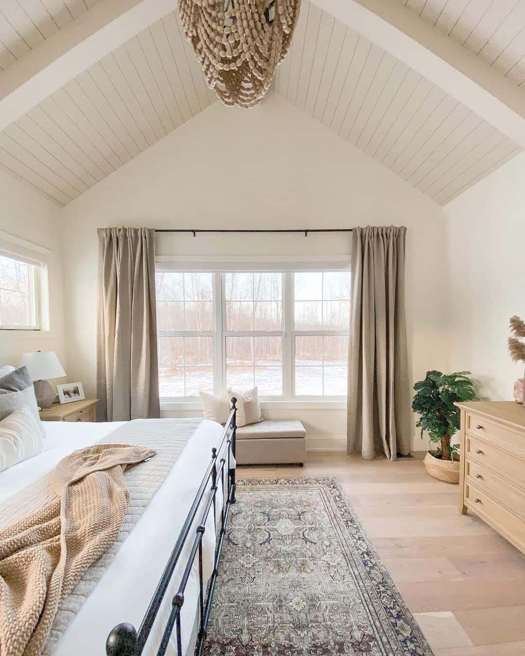 Beaded Chandelier Adds Organic Texture Above the Bed