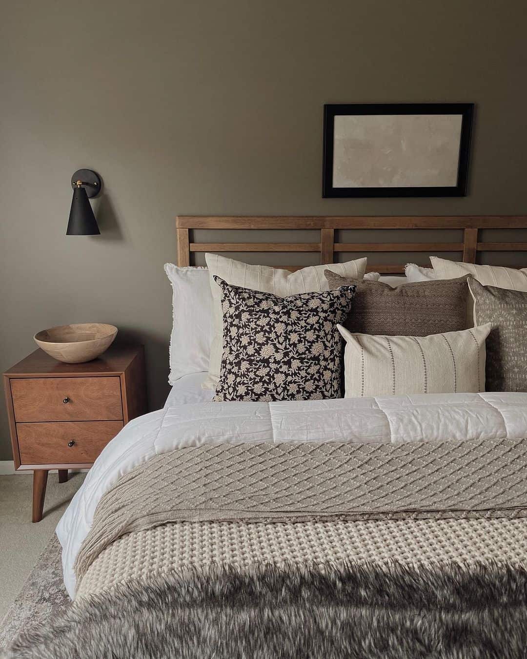 Introduce Organic Warmth with a Wooden Nightstand and Carved Bowl