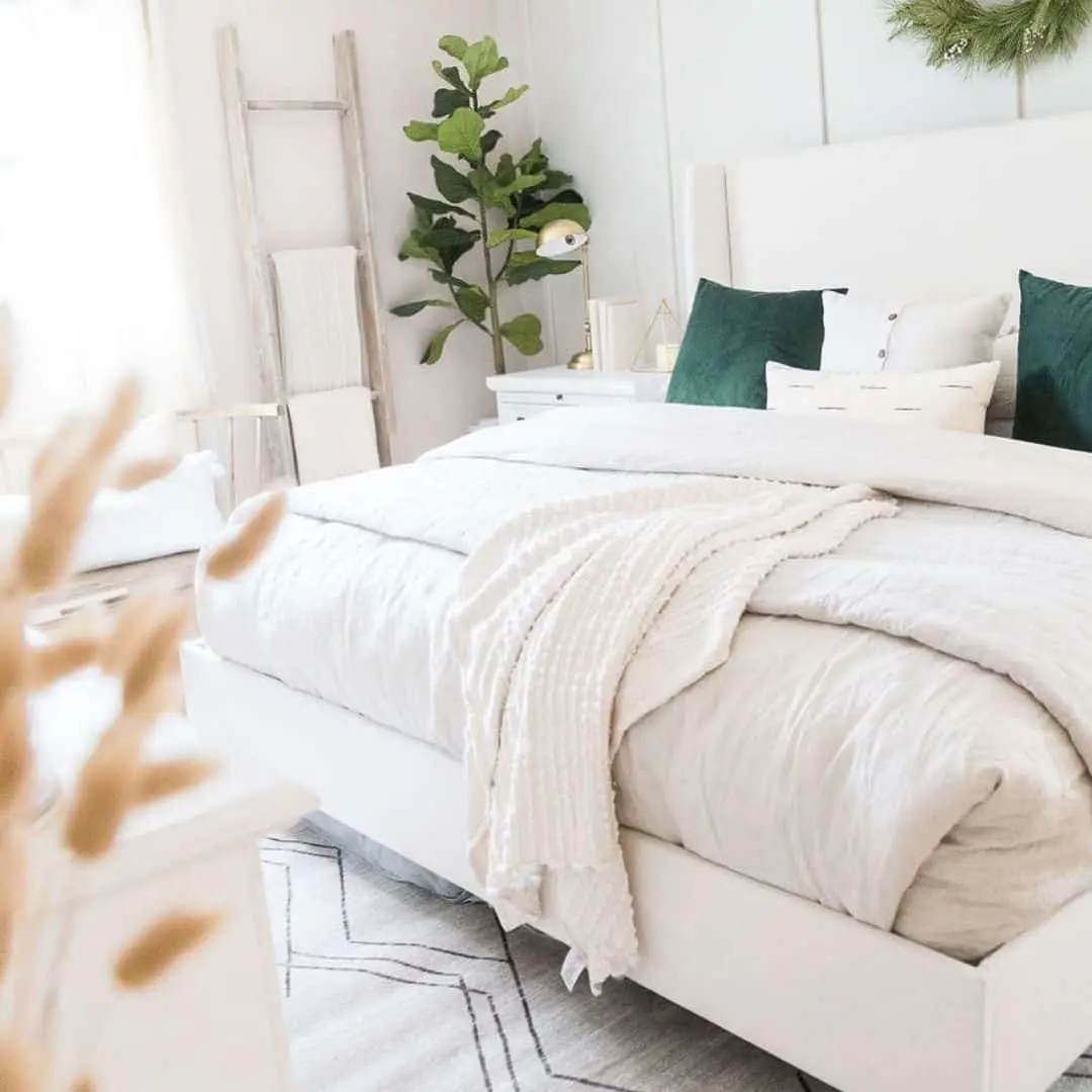 White Ladder Displaying Folded Towels and Blankets