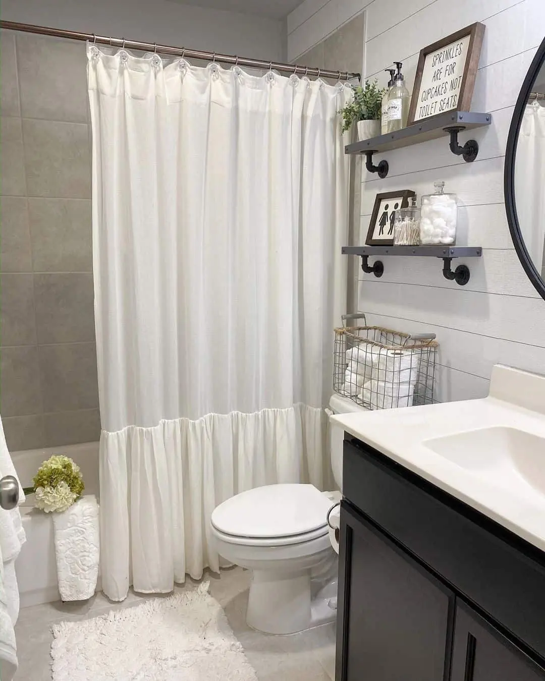 Industrial Pipe Shelving Adds Vertical Storage Above the Toilet