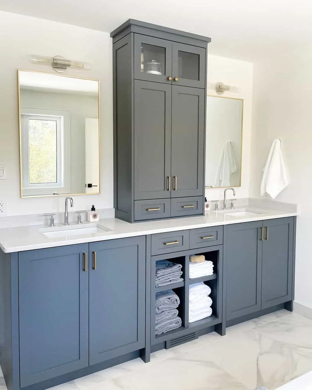 Open Shelving Between Cabinets Displays Rolled Towels