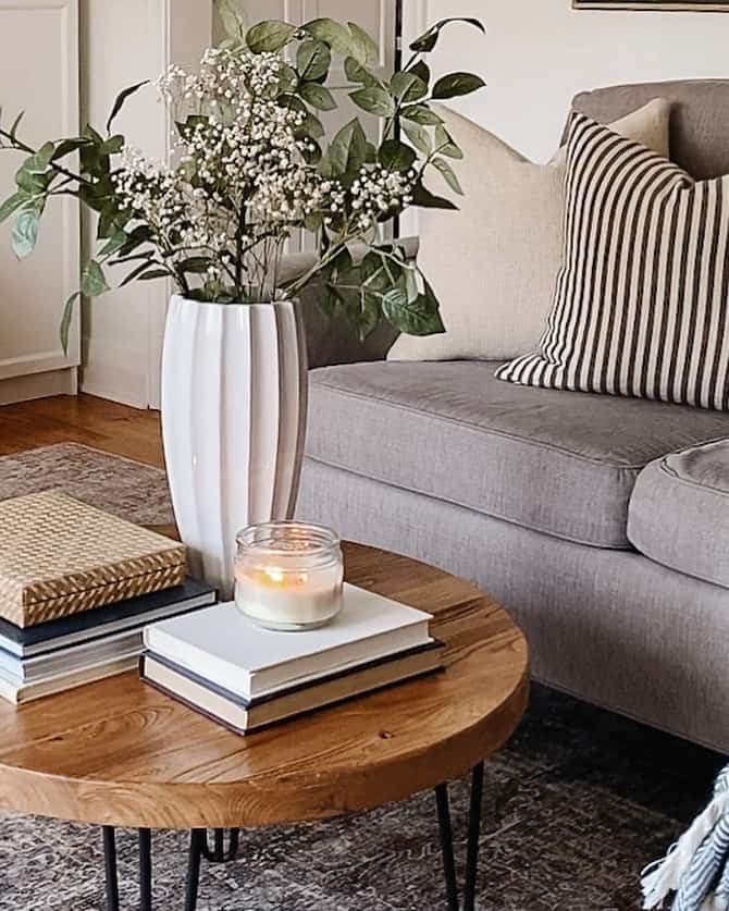 Fluted White Vase Holds Delicate Baby's Breath and Greenery