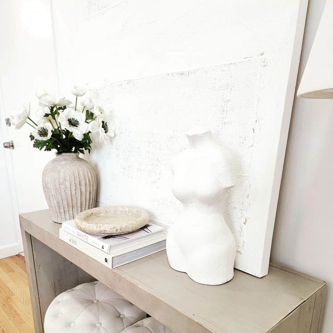 White Torso Sculpture Adds an Artistic Touch to Console Table