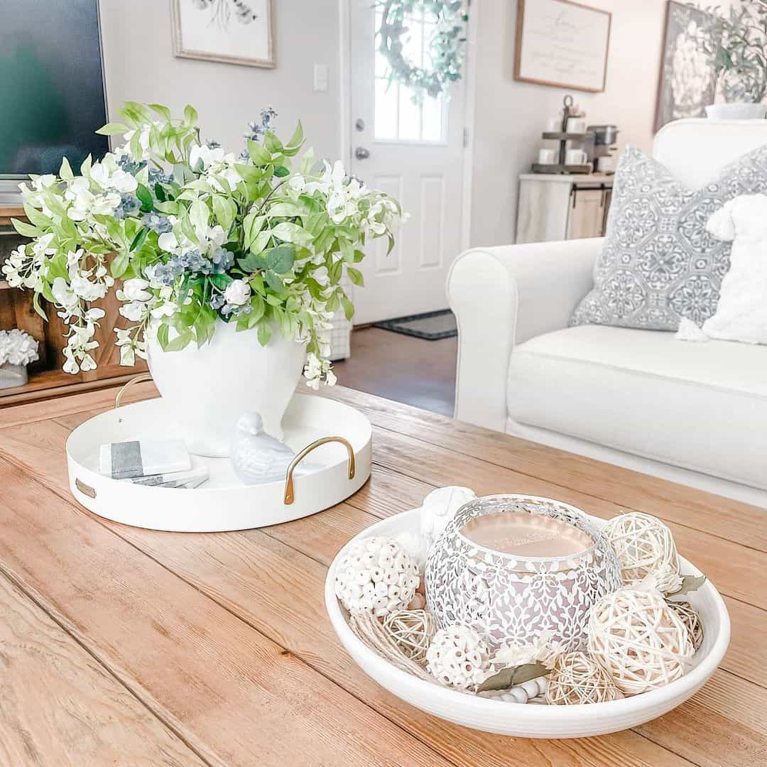 White Bowl Holds Textured Orbs and a Decorative Candle