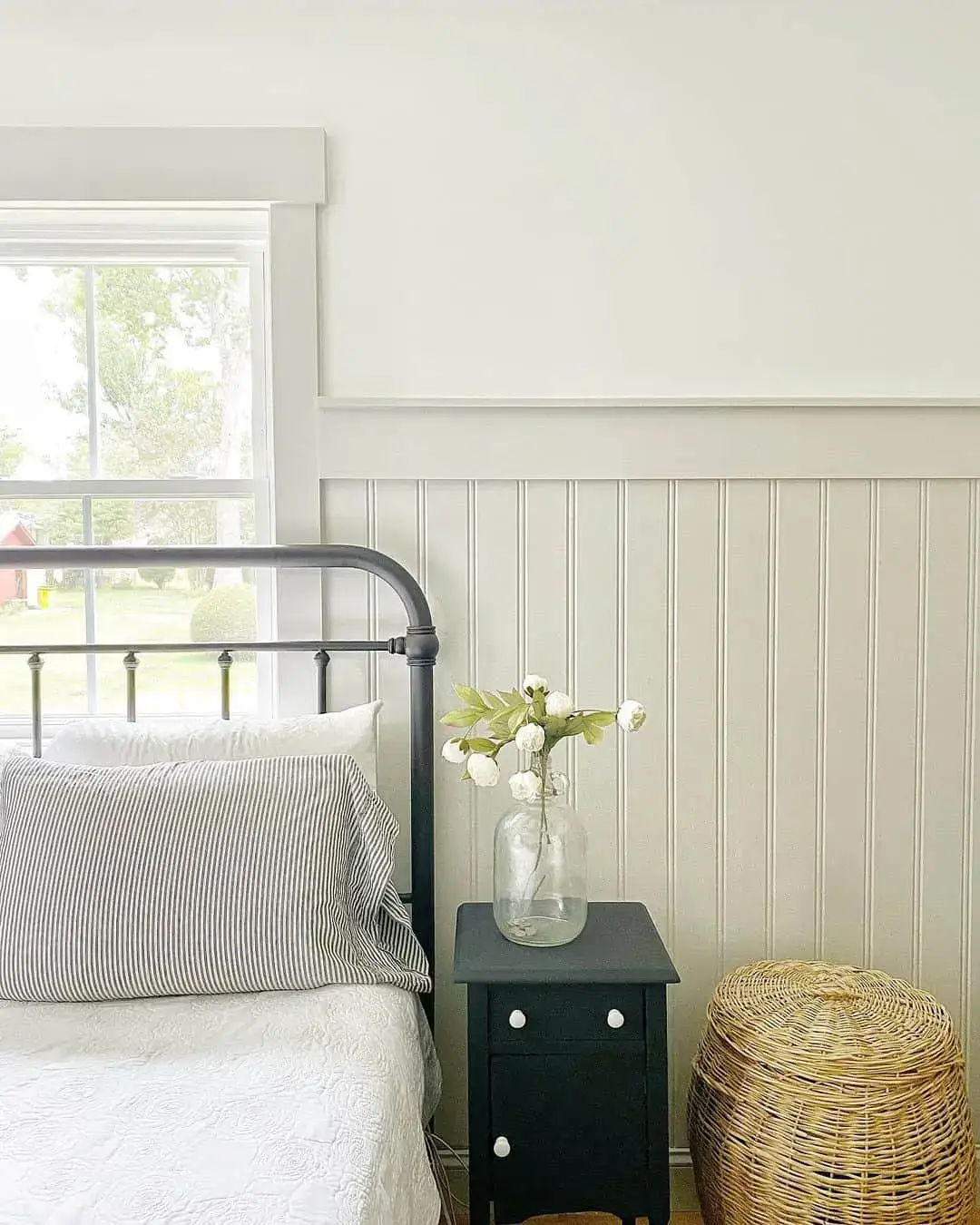 Black Nightstand Adds Dramatic Contrast to Light Room