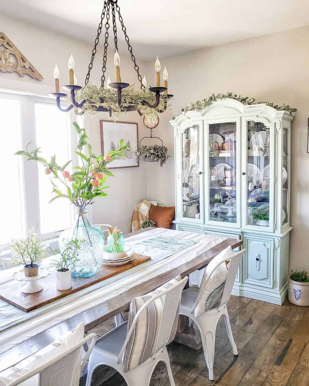 Large Blue Glass Bottle Holds Peaches and Greenery