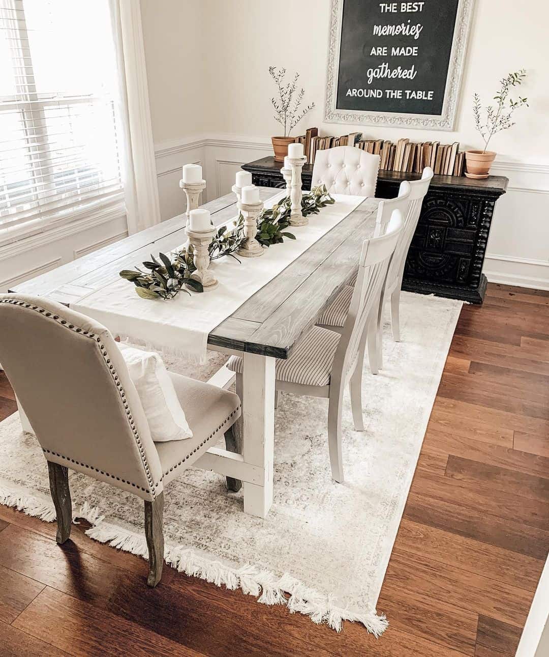 Candlesticks and Greenery Adorn a Table Runner