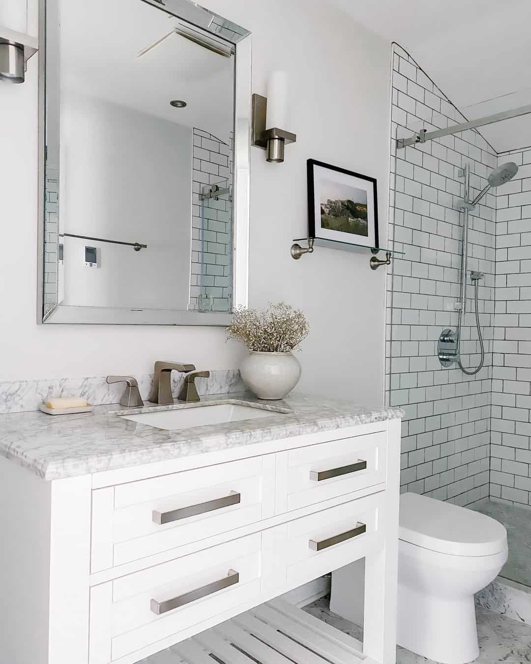 Framed Artwork Adds a Landscape View Over the Toilet