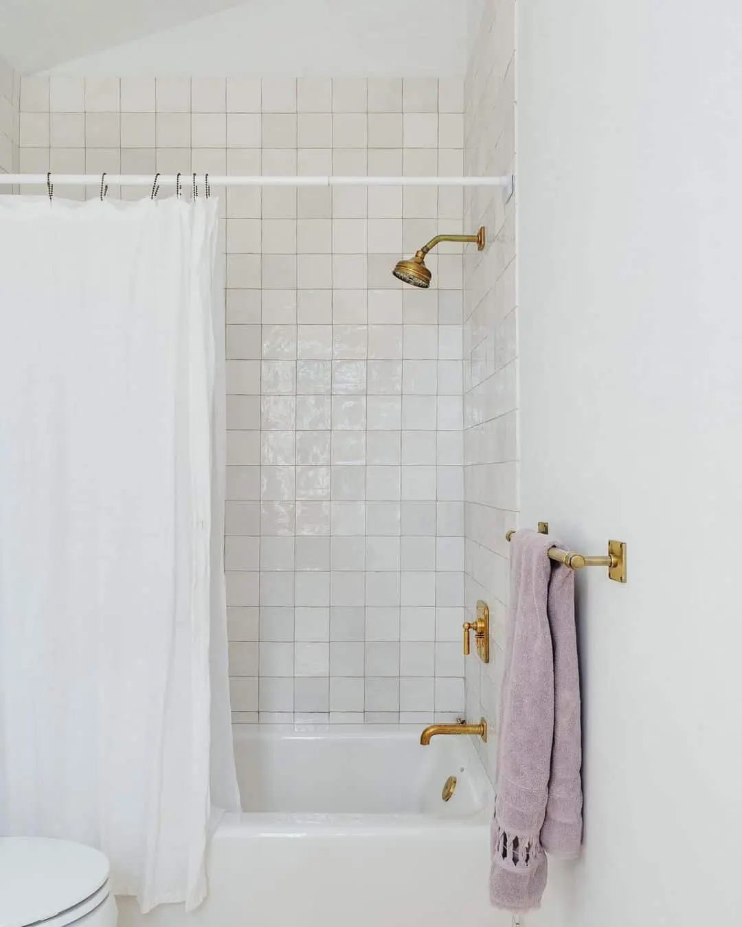 Warm Up White Walls with Brass Fixtures
