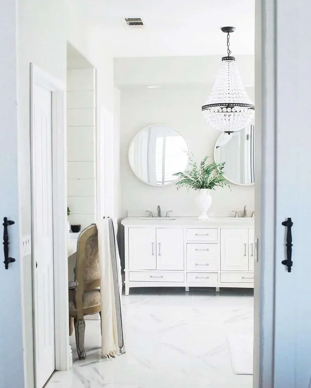 Crystal Chandelier Adds Glamour Above White Vanity