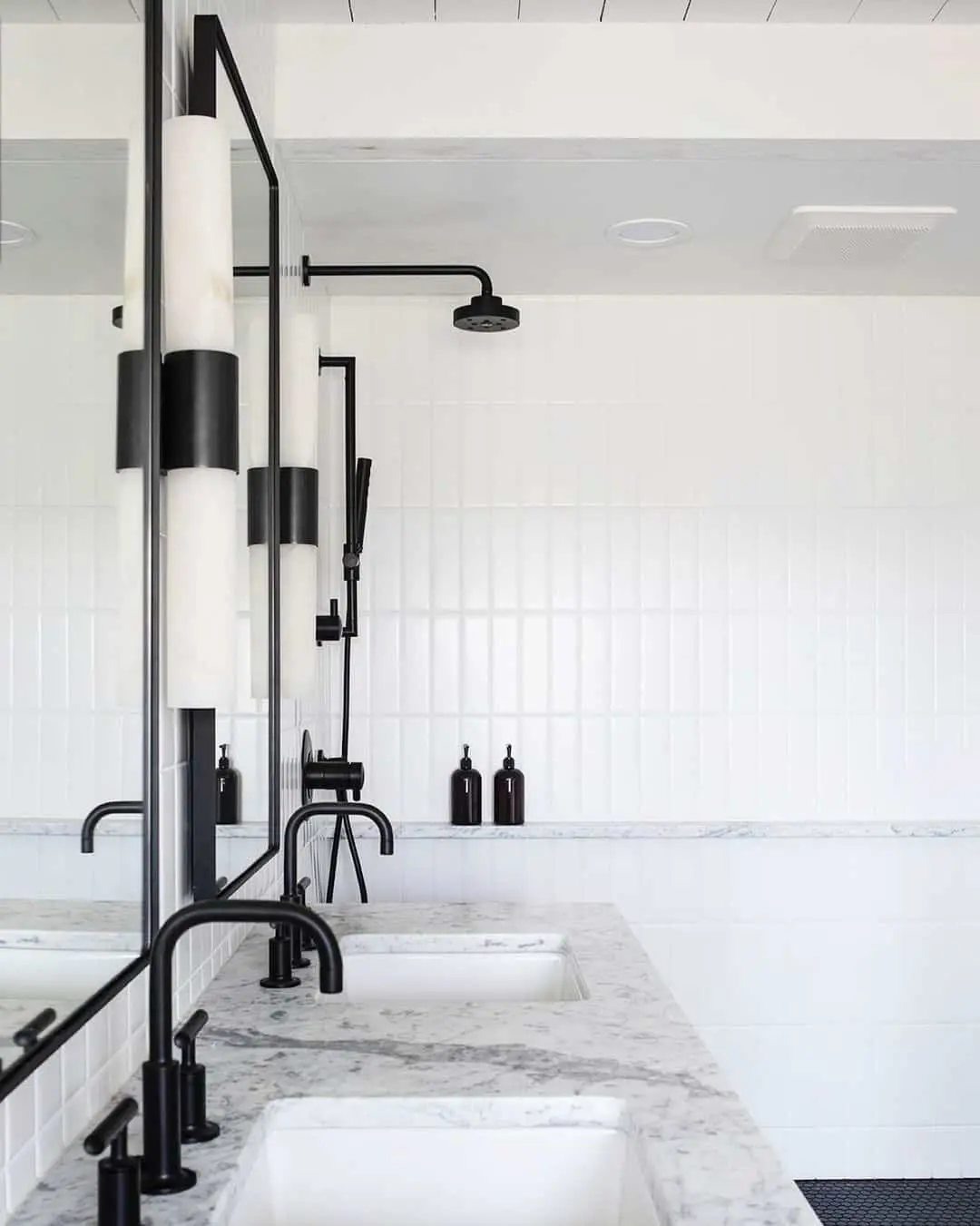Curved Matte Black Faucets Complement Marble Vanity