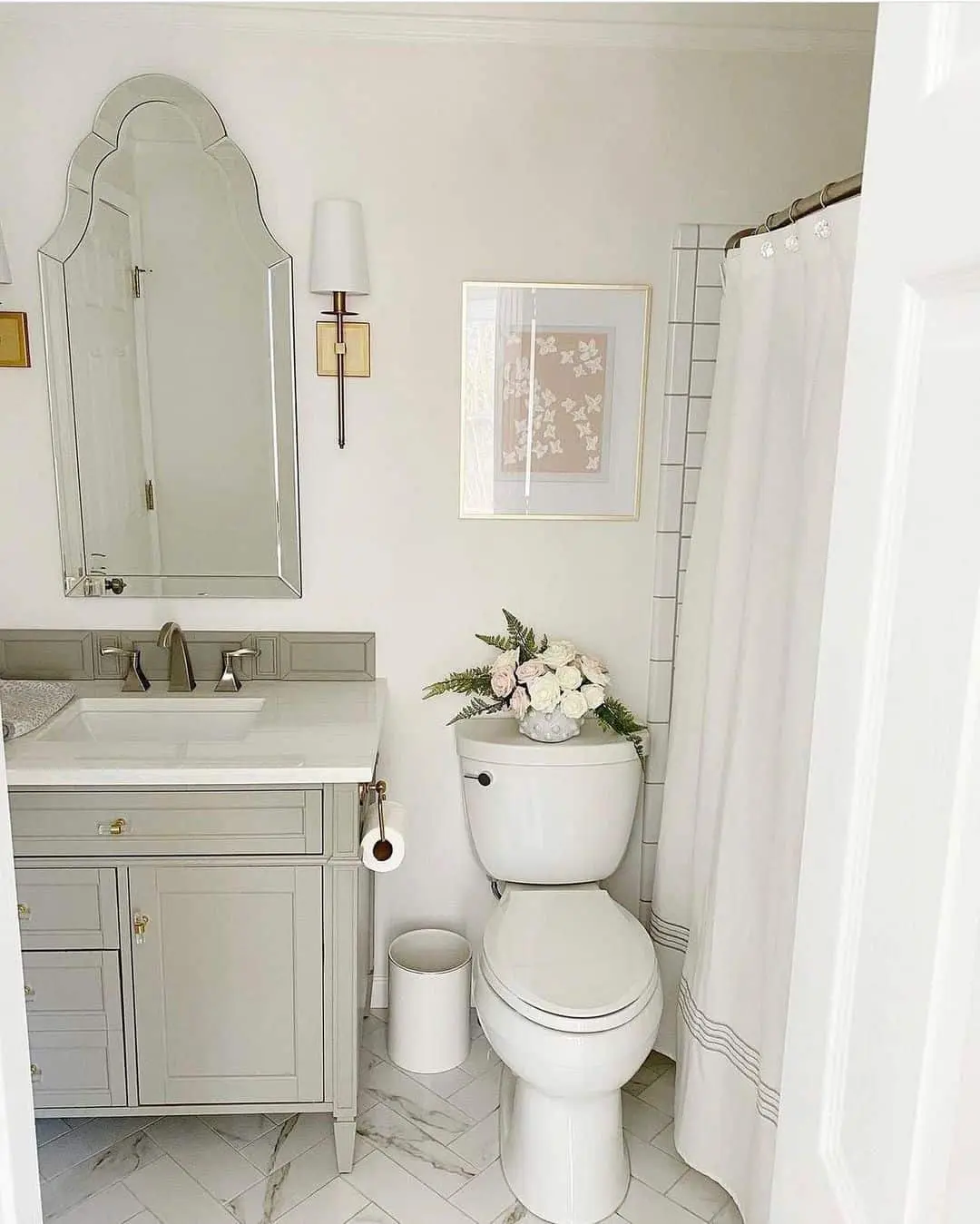 Botanical Art Adds Soft Color Above the Toilet