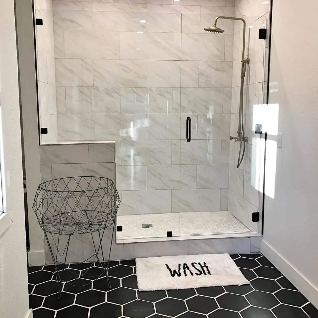 Marble-Look Tile Walls Offer a Serene Shower Enclosure