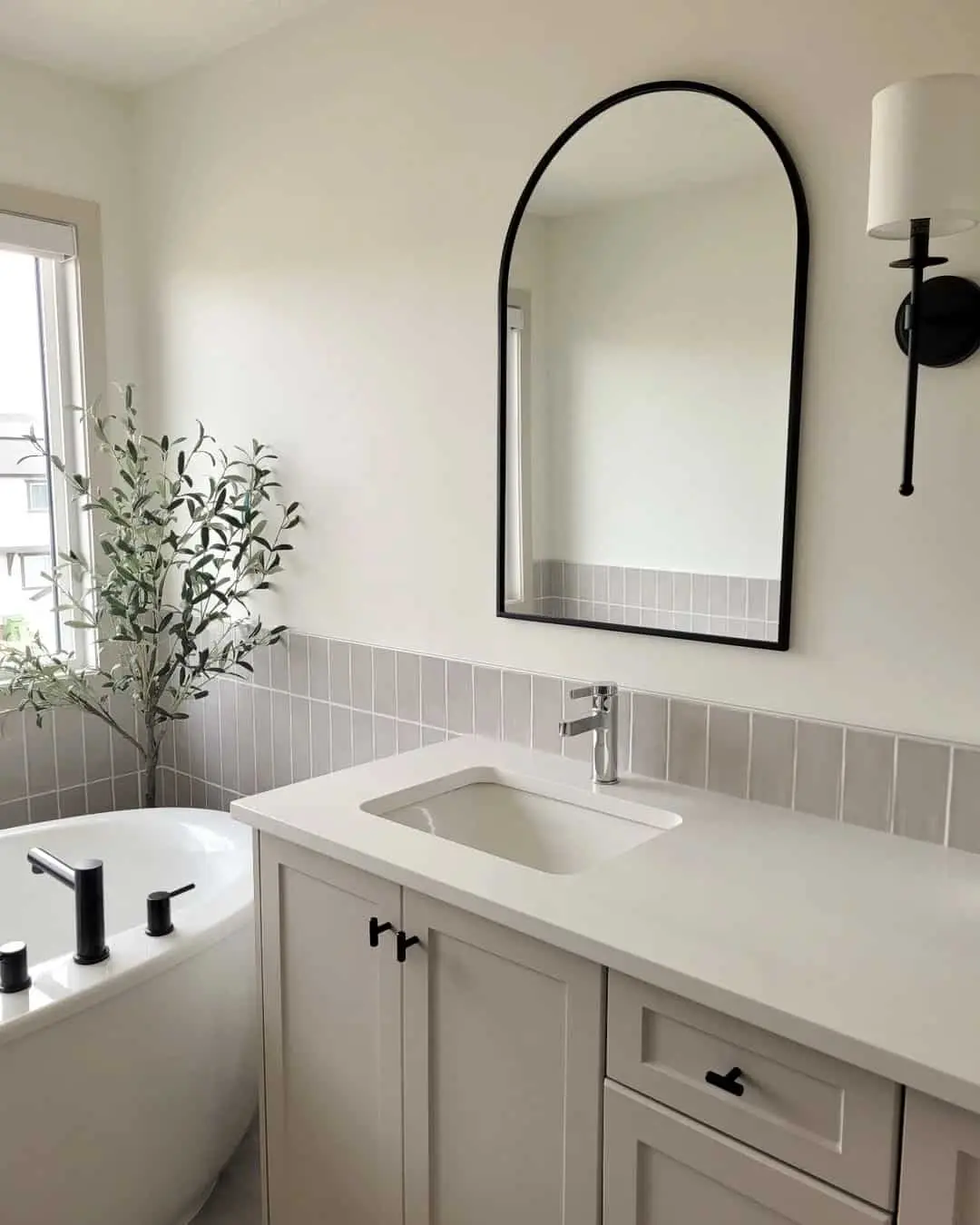 Arched Mirror Adds Softness Above a Simple Vanity