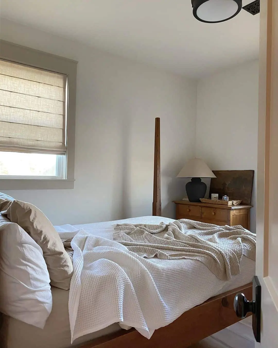 Wooden Bed Posts Add Height to a Small Room