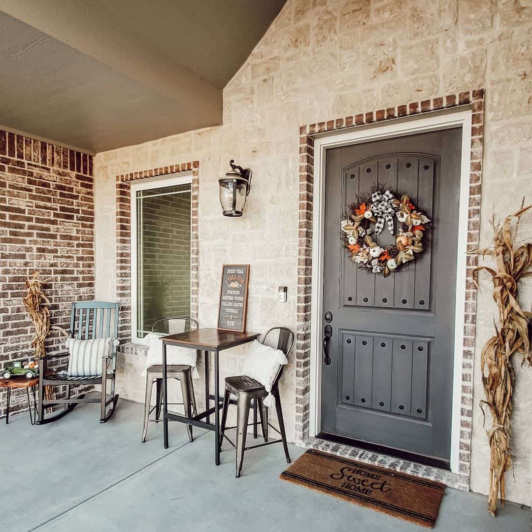 Small Metal Table and Stools Create an Inviting Entryway Nook