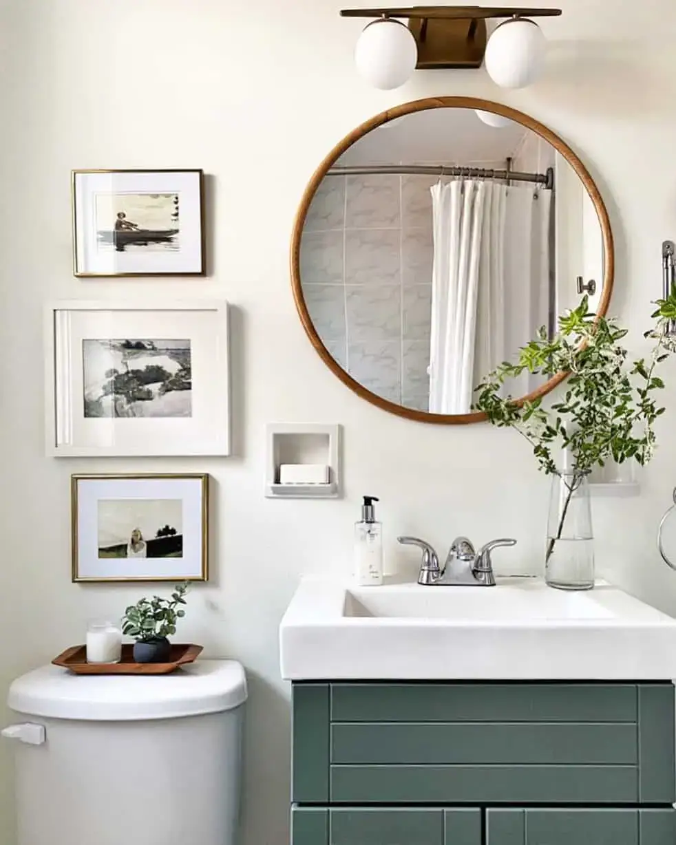 Stacked Art Pieces Add Vertical Interest Above Toilet
