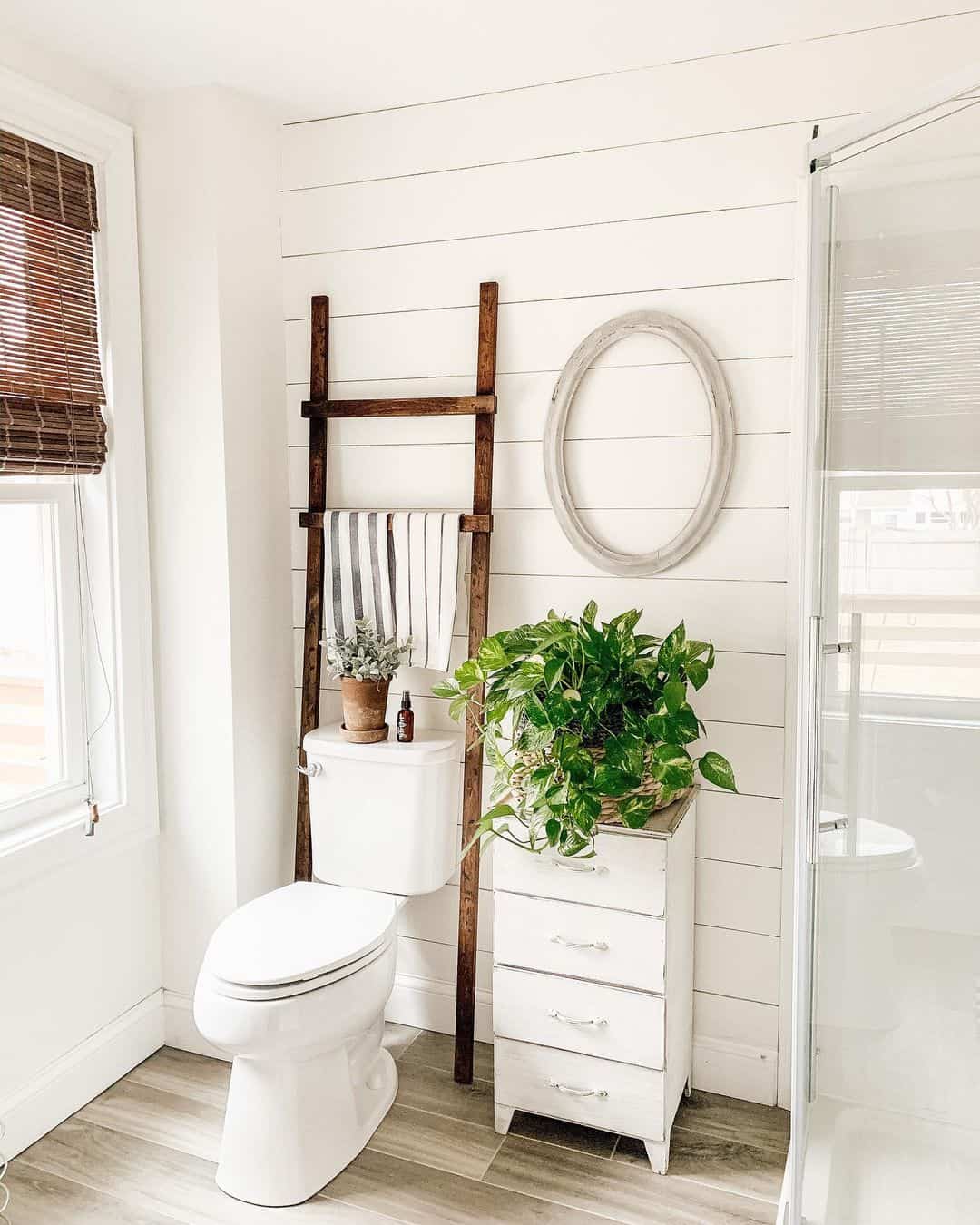 Wooden Ladder Adds Vertical Towel Storage Next to Toilet