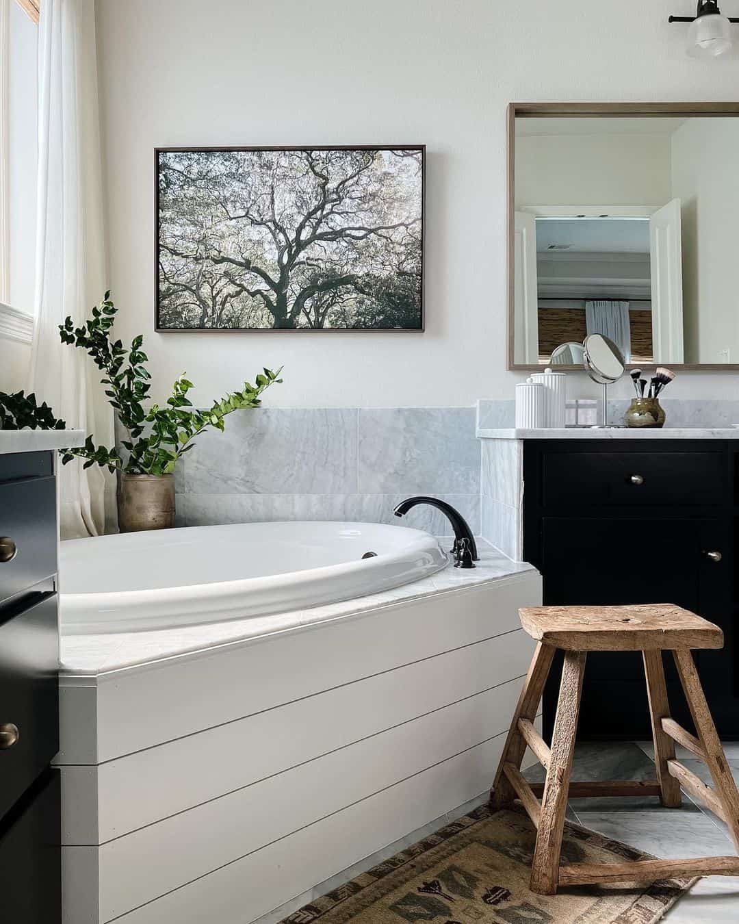 Large Tree Artwork Creates a Natural Focal Point Above the Tub